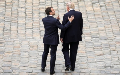 PARIS,  FRANCE - JULY 13:  French President Emmanuel Macron welcomes US President Donald Trump at Les Invalides As part of the commemoration of the 100th anniversary of the entry of the United States of America into World War I on July 13,  2017 in Paris,  France. US President,  Donald Trump will attend a military parade during Bastille Day.  (Photo by Pierre Suu/Getty Images)